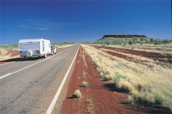 Red Centre Way with Mt Connor in the distance on the right