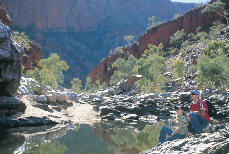 Ormiston Gorge | Travelling to Ormiston Gorge, keep your eyes peeled for Perentie Lizards lazing along the banks and take a swim in the rock holes. Hike the “Ghost Gum Walk”, a 1.5 hour loop that takes in views down through the majestic Ormiston Gorge, before following the trail as it descends down close to the gorge and along the rocky floor and Ormiston Waterhole.